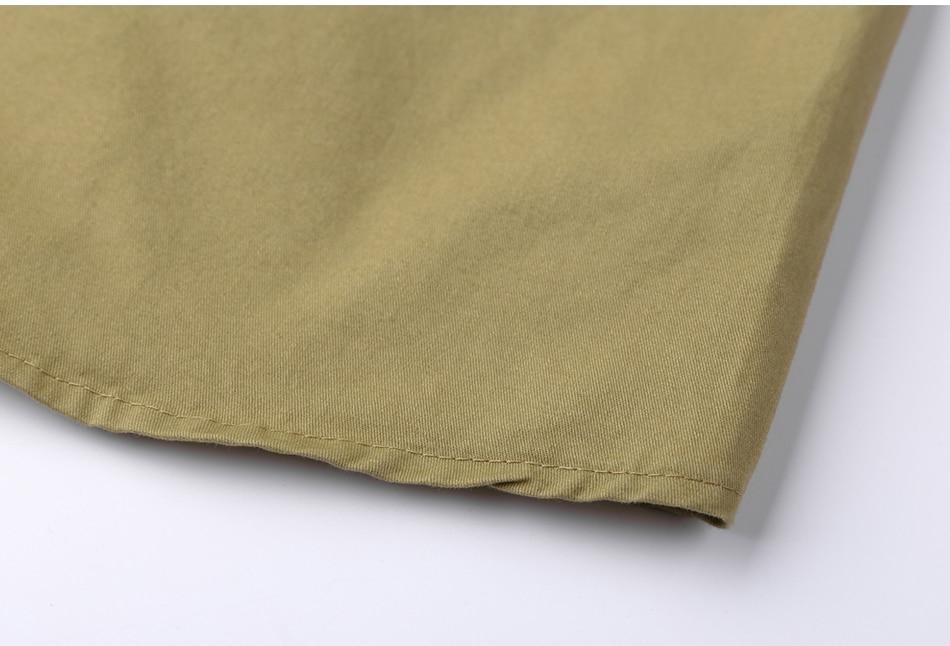 Close-up of a military cotton shirt's short sleeve in olive green, perfect for alternative fashion styles.