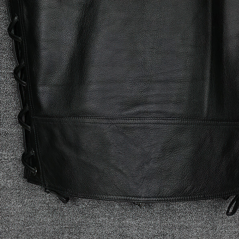 Close-up of the laced-up sides of a black leather vest, showcasing its biker style and unique detailing.
