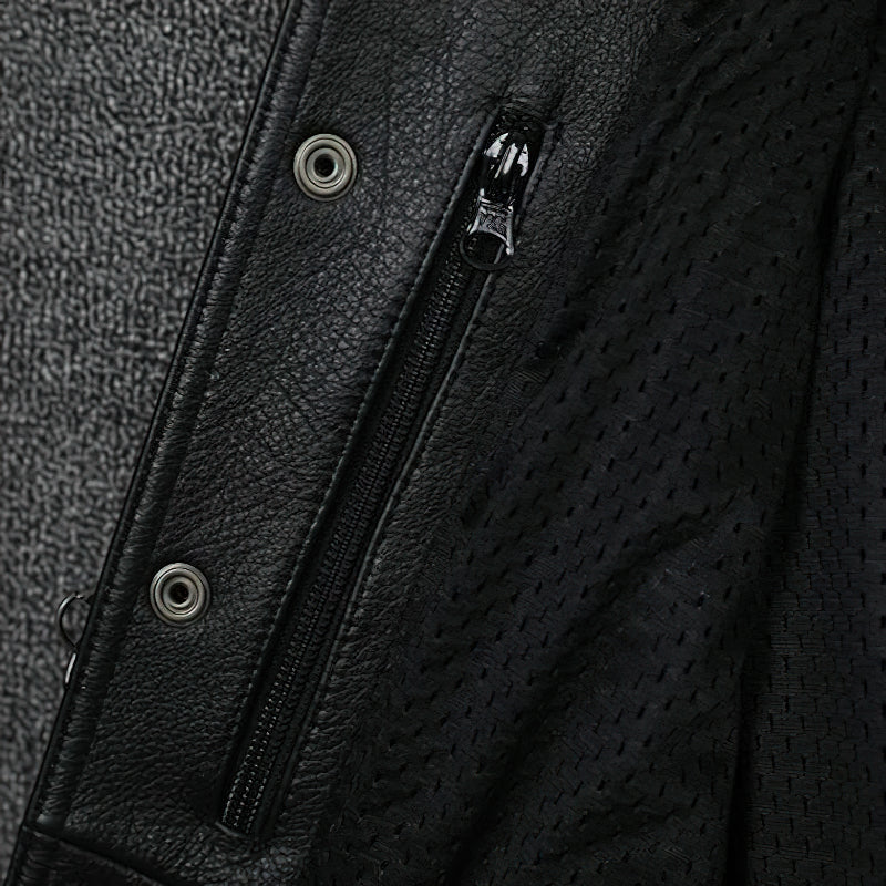 Close-up of black leather vest featuring zipper and eyelets, showcasing biker style and punk fashion details.