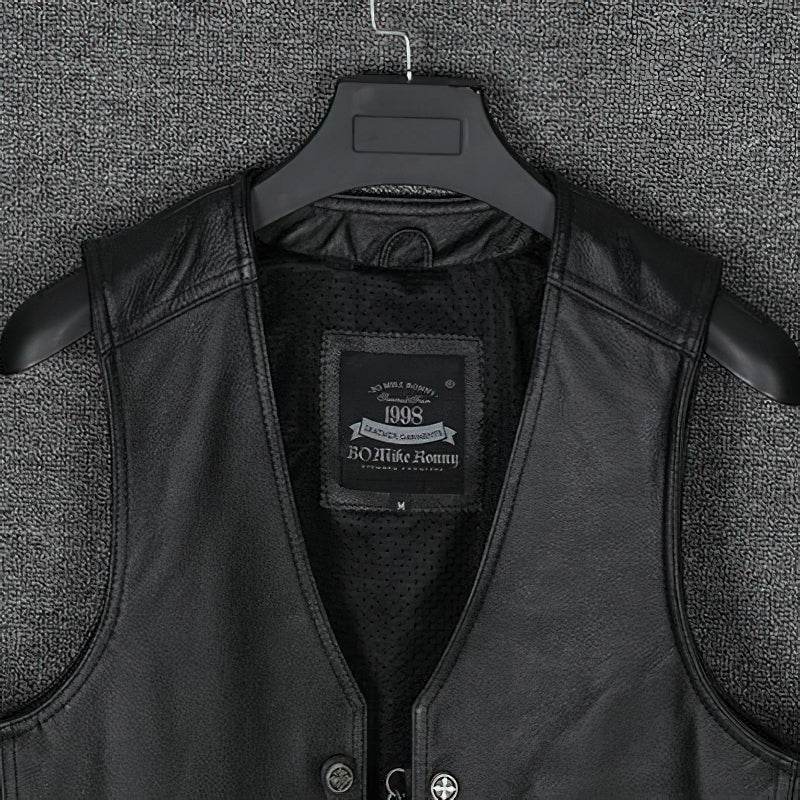 Close-up of collarless men's black leather vest showcasing the inner lining and brand label, perfect for biker and punk styles.