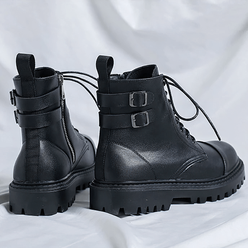 Stylish men's black lace-up ankle boots with buckles and rubber sole, perfect for casual wear.