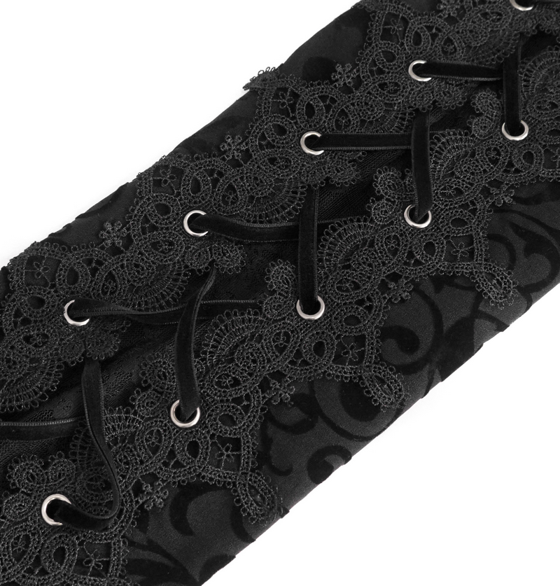 Black lace detailing with lacing and eyelets on stylish fabric, perfect for gothic-inspired fashion.
