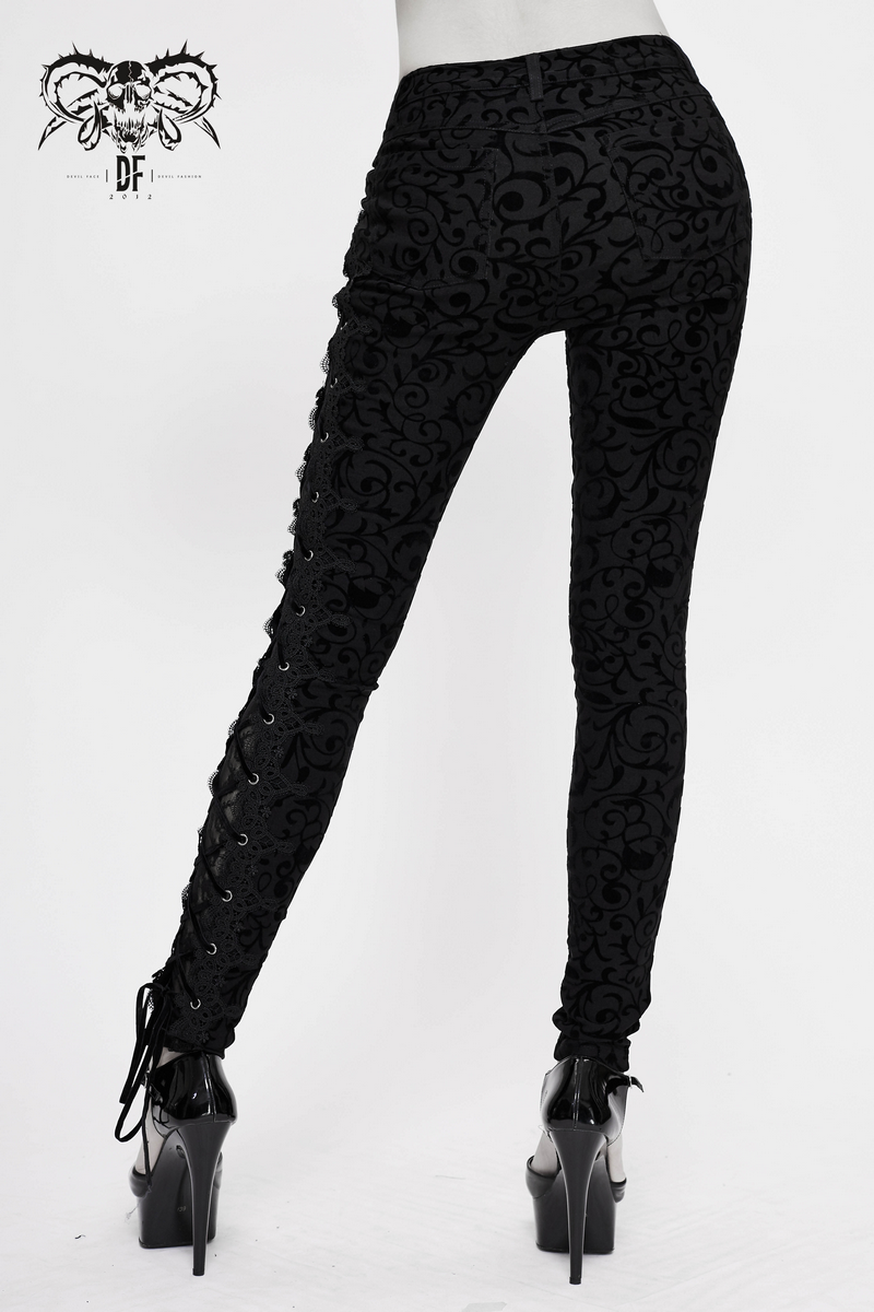 Stylish women's black gothic leggings with side lacing, featuring intricate patterns and a form-fitting cut.
