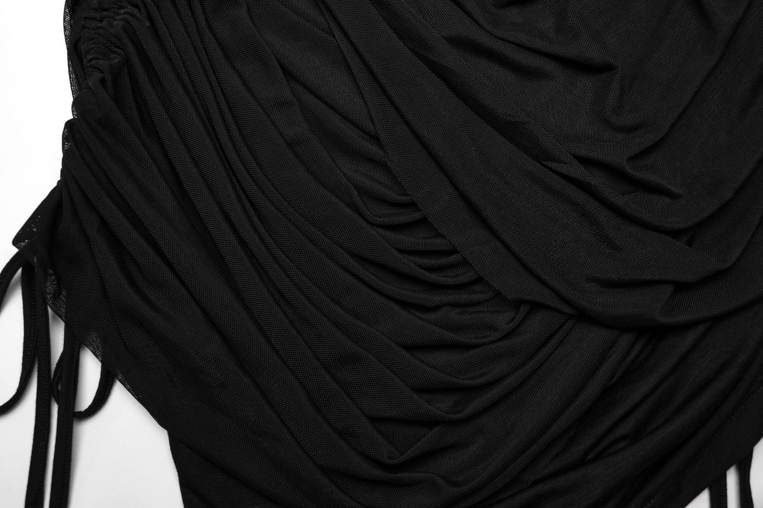 Close-up of a black convertible pleated mesh skirt showcasing its elegant drape and wrap design.