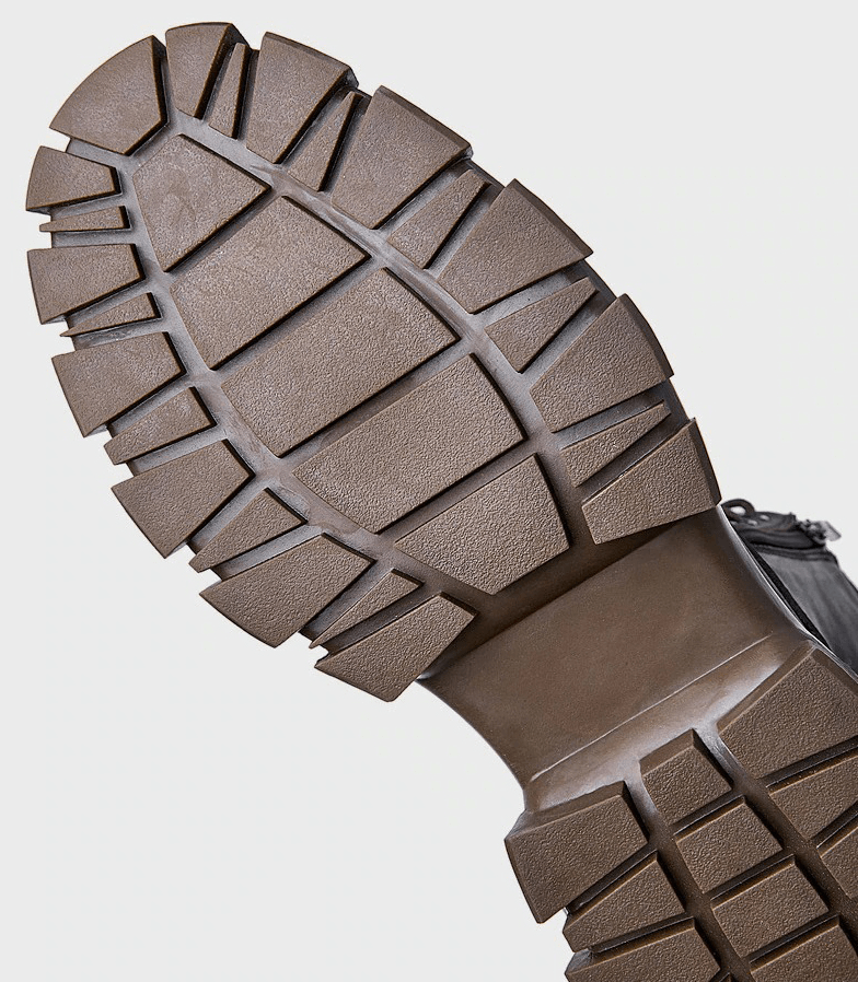 Sole of men's warm fur lining mid-calf leather boots with rugged traction design for durability.