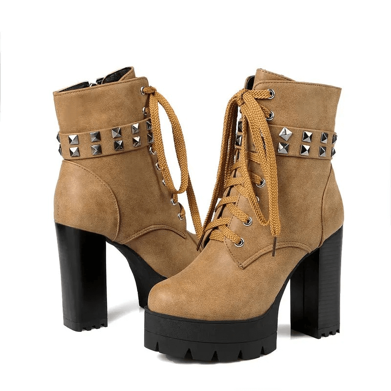 Cool women's winter high heel boots in rock style with rivets and laces for a daring biker look.