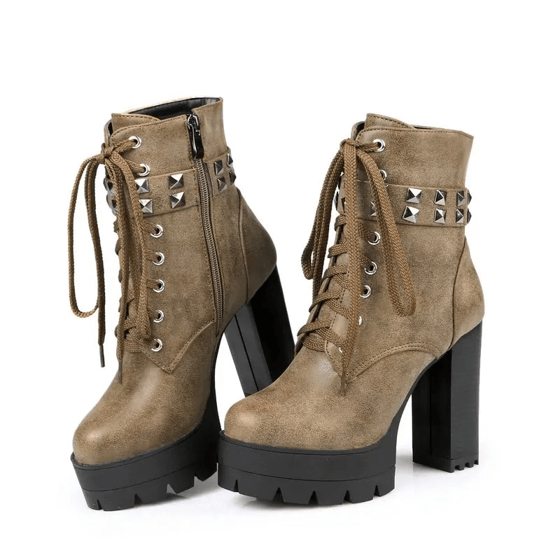 Stylish women's high heel winter boots in rock style, featuring rivets, laces, and a chunk platform sole.