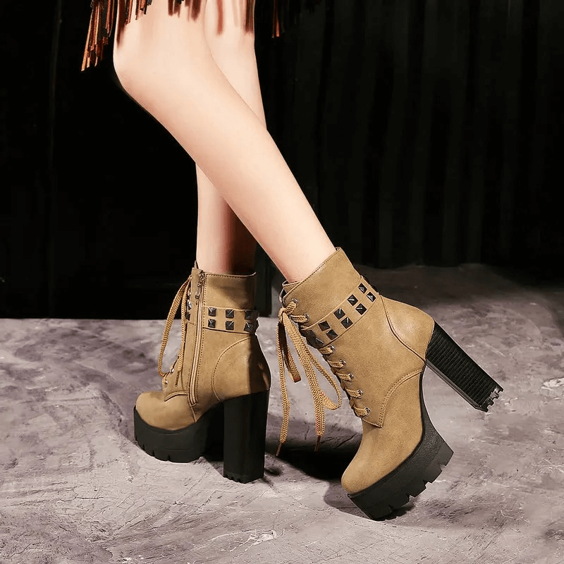 Women's cool rock style boots with heels, featuring rivets and laces for biker fashion, perfect for winter wear.