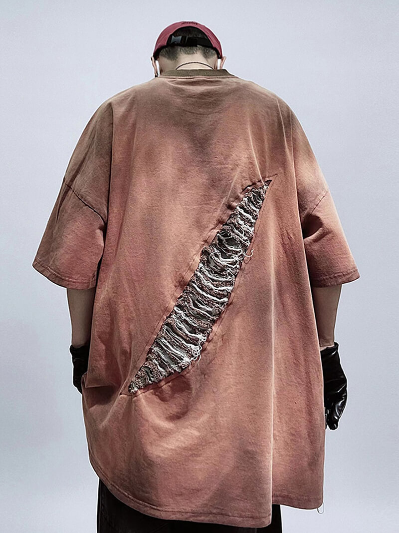 Men's vintage oversized hole-ripped T-shirt showcasing distressed details and relaxed fit for trendy style.