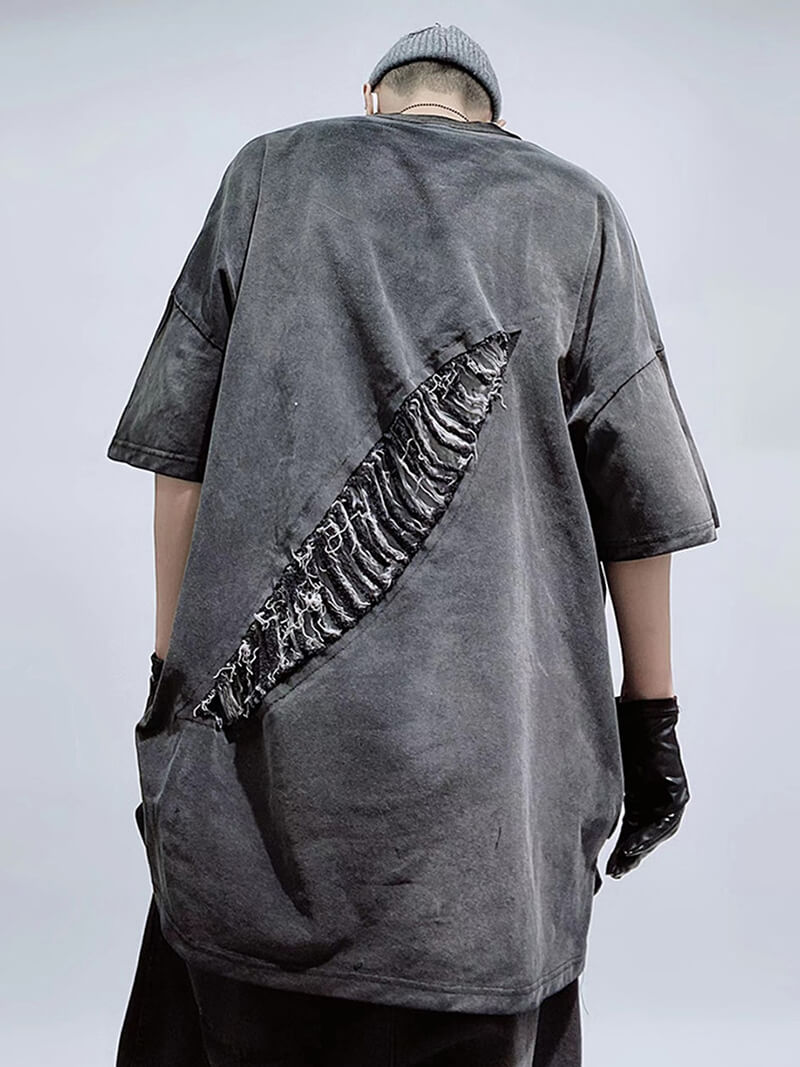 Oversized men's vintage cotton T-shirt with large distressed hole detail on back, perfect for a trendy streetwear look.
