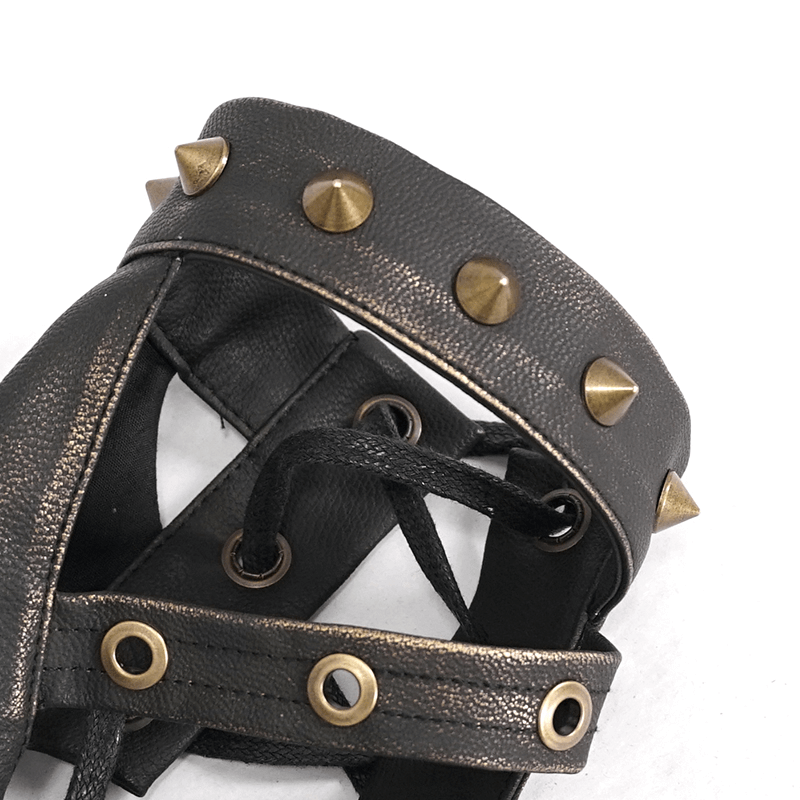 Close-up of cool steampunk fingerless gloves with bronze spikes for punk fashion lovers.