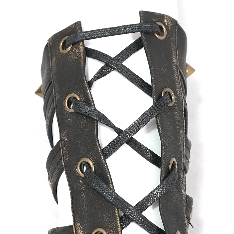 Close-up of cool steampunk cross strap long gloves with spikes and bronze rivets, ideal unisex punk fashion accessory.