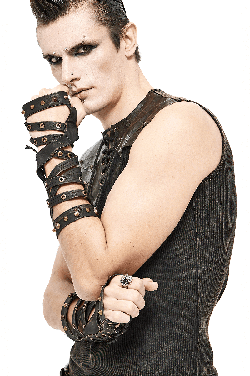 Model showcasing edgy unisex steampunk cross strap fingerless gloves with bronze rivets for punk fashion style.