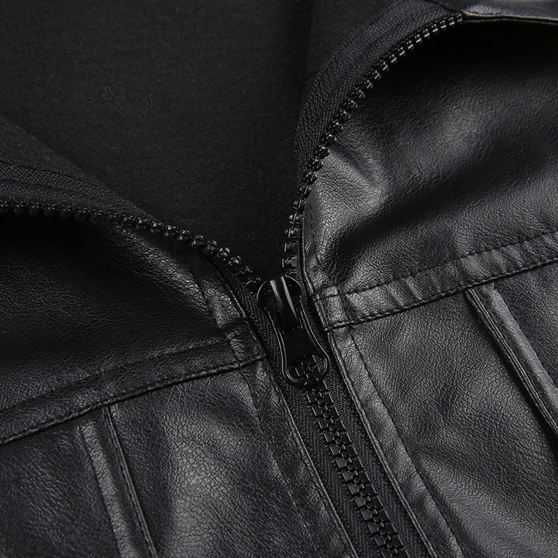 Close-up of a black PU leather cropped jacket featuring a zipper and stylish turn-down collar for a trendy look.