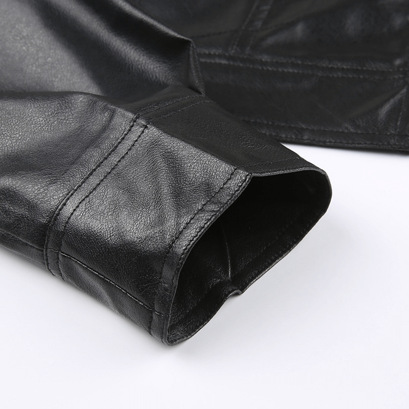 Close-up of the cuff of a black PU leather cropped jacket showcasing stylish stitching and texture.