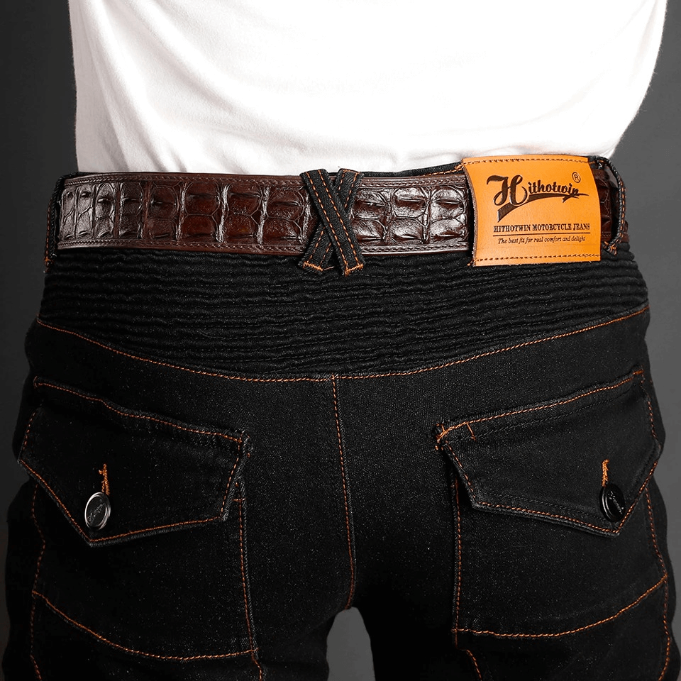 Stylish back view of cool vintage motorcycle protective pants with detailed stitching and textured belt for men.