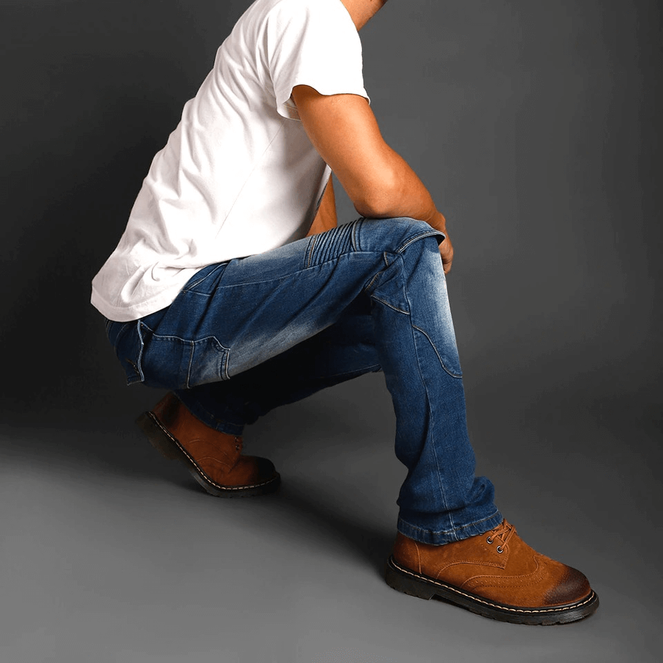 Man wearing cool vintage motorcycle protective pants in blue, showcasing biker style and comfort.