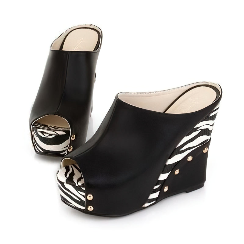Stylish black wedge sandals with zebra print design and peep toe, perfect for summer fashion.