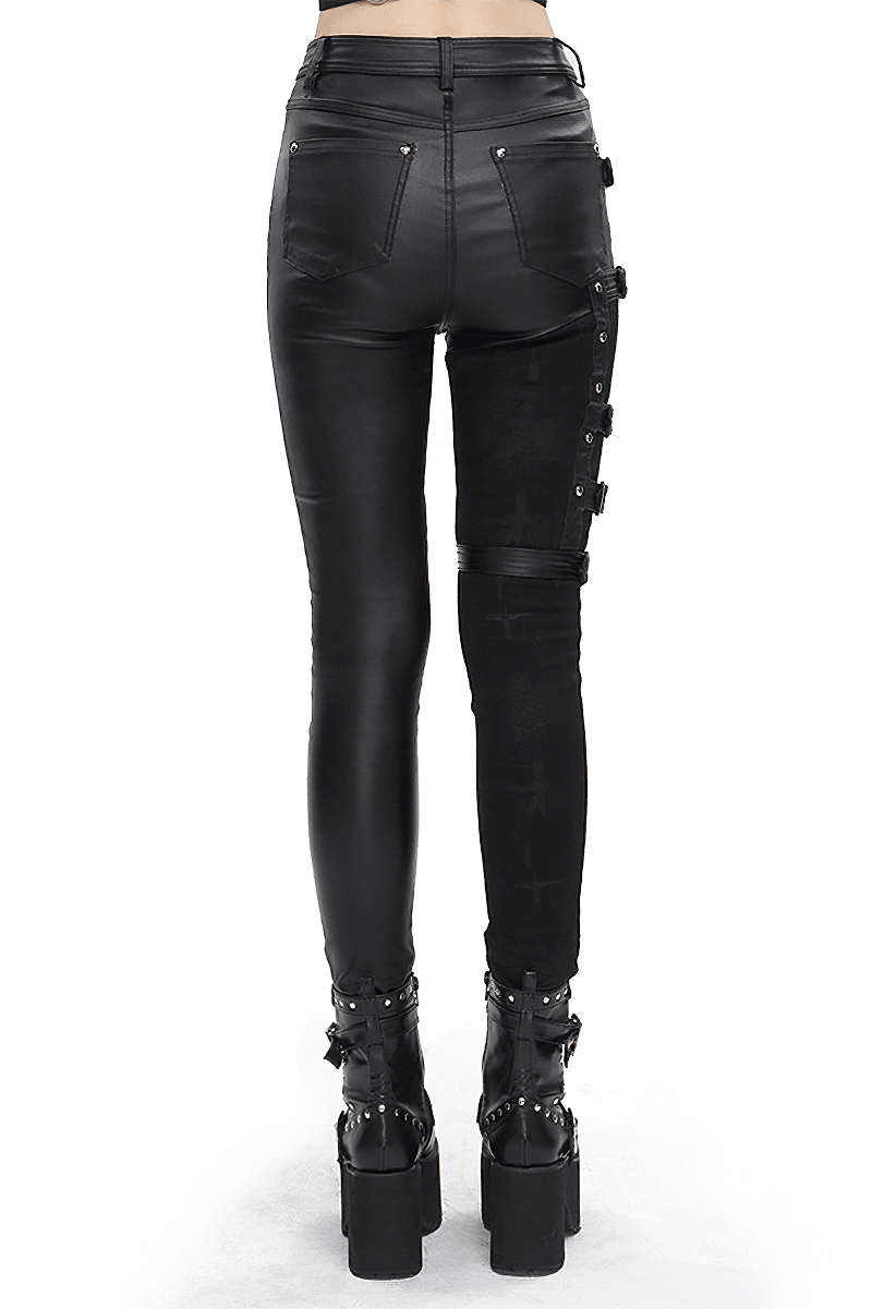 Back view of women's punk style multi-buckle splice pants, featuring sleek black fabric and bold buckle details.