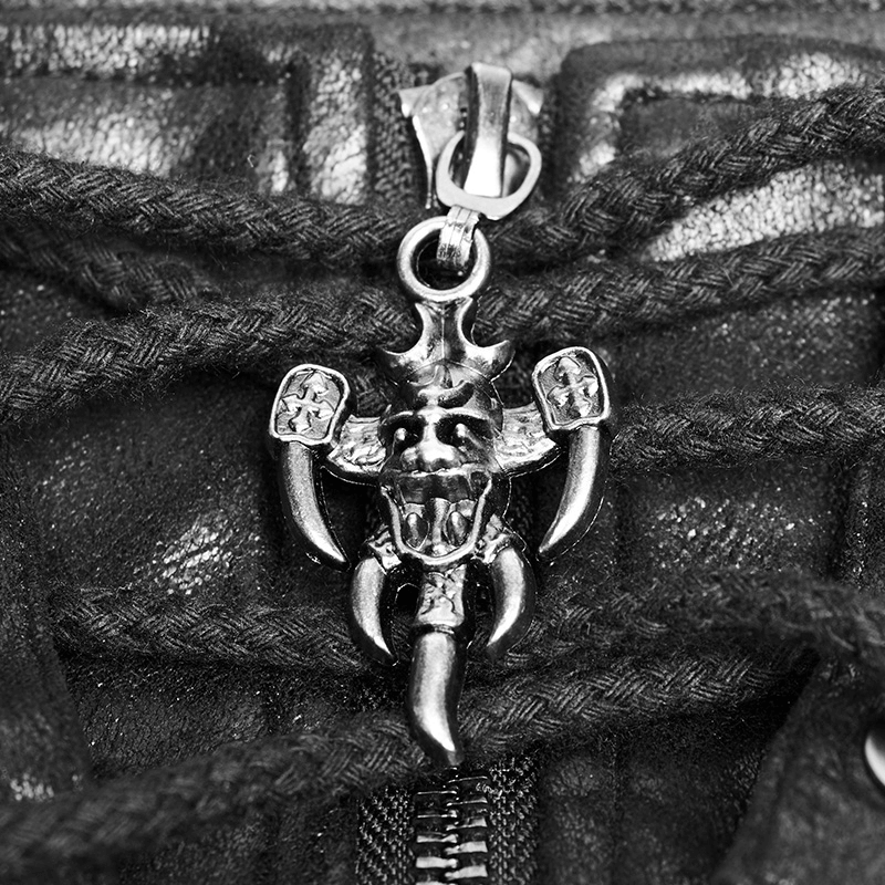 Close-up of a punk hoodie zipper with a skull charm, featuring detailed horns and a rugged design.
