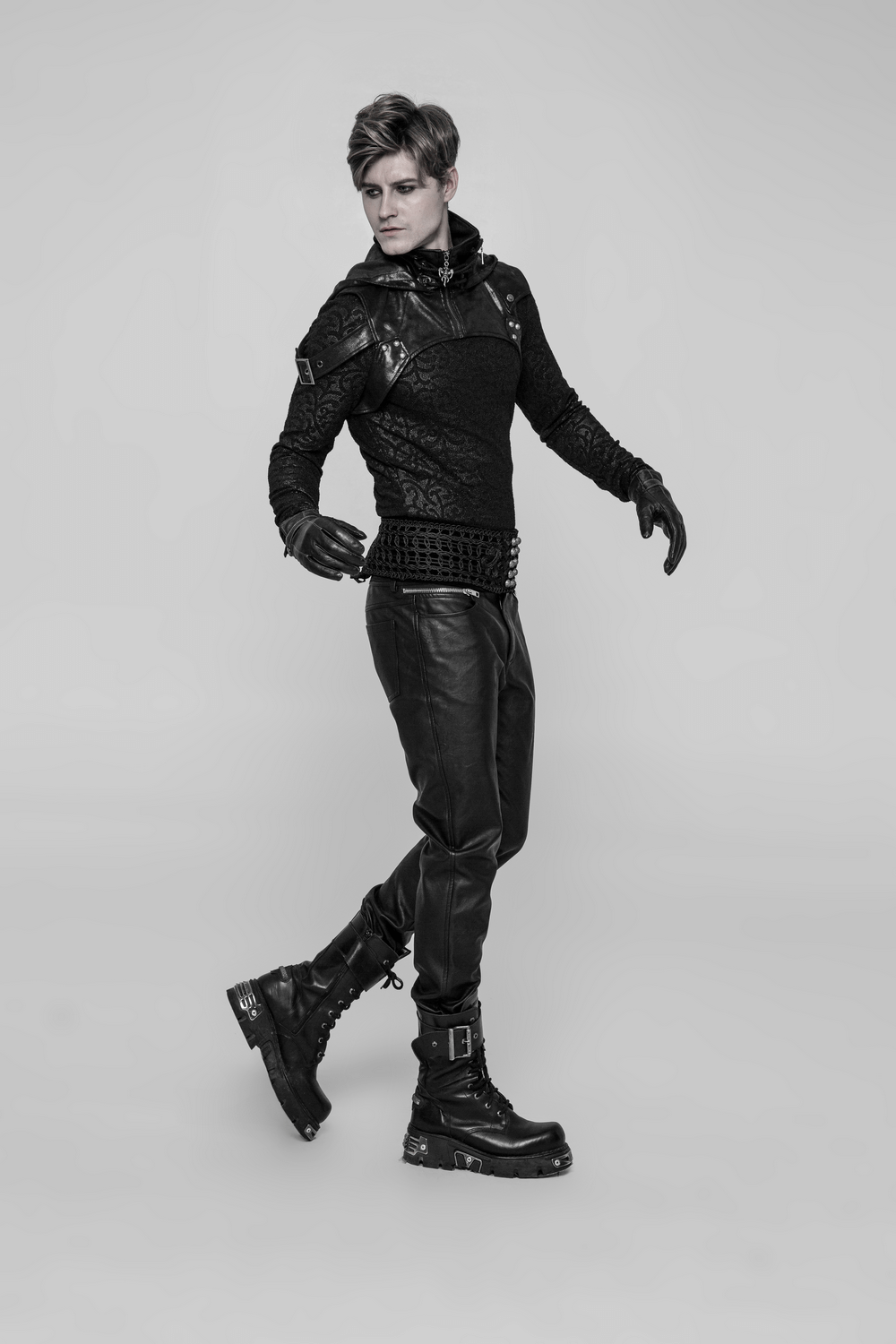 Model showcasing a crack skin stitched punk hood accessory with gloves and stylish boots.