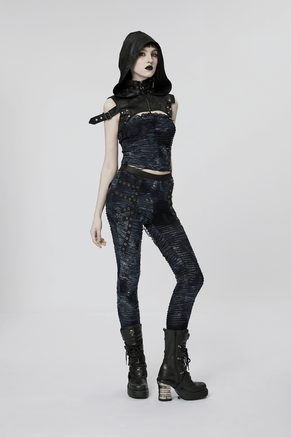 Stylish model showcasing a rugged cracked faux leather gothic hooded harness with skull pendant.