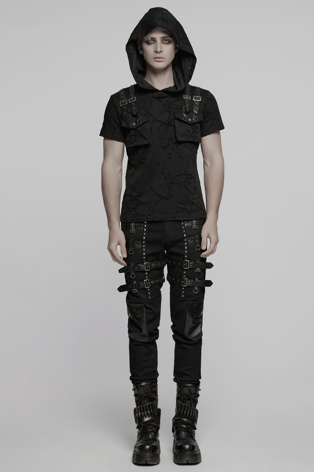 Model wearing cracked texture hooded punk T-shirt with dual pockets and decorative shoulder straps.