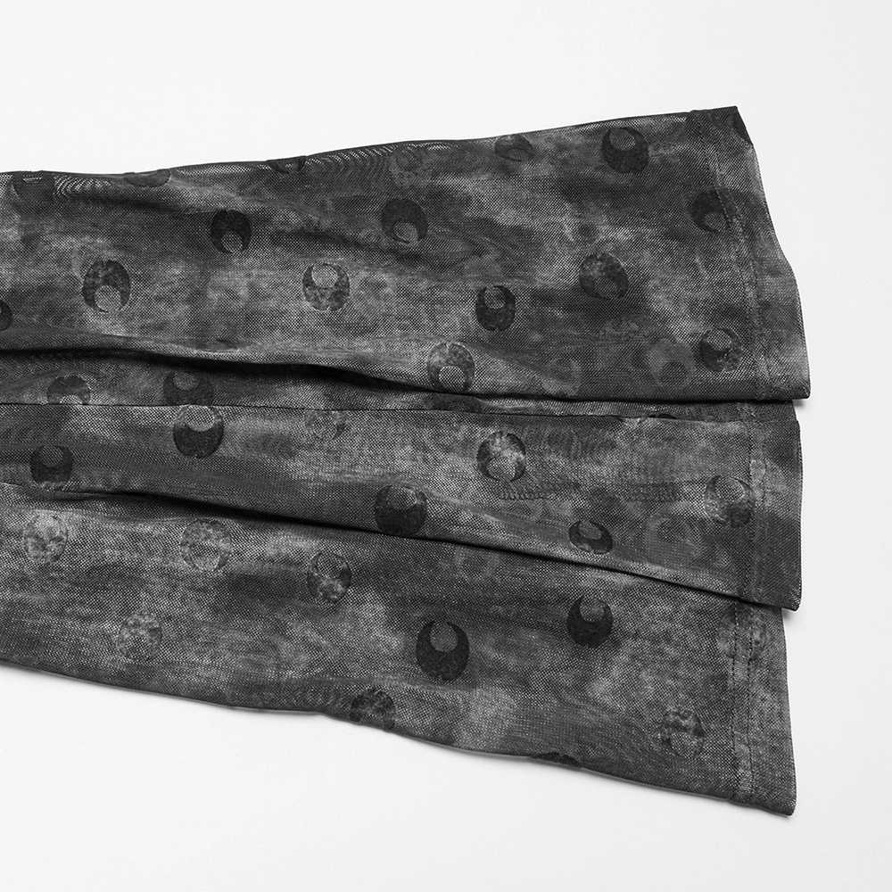 Crescent moon printed mesh flare pants showcasing intricate pattern and soft fabric texture.