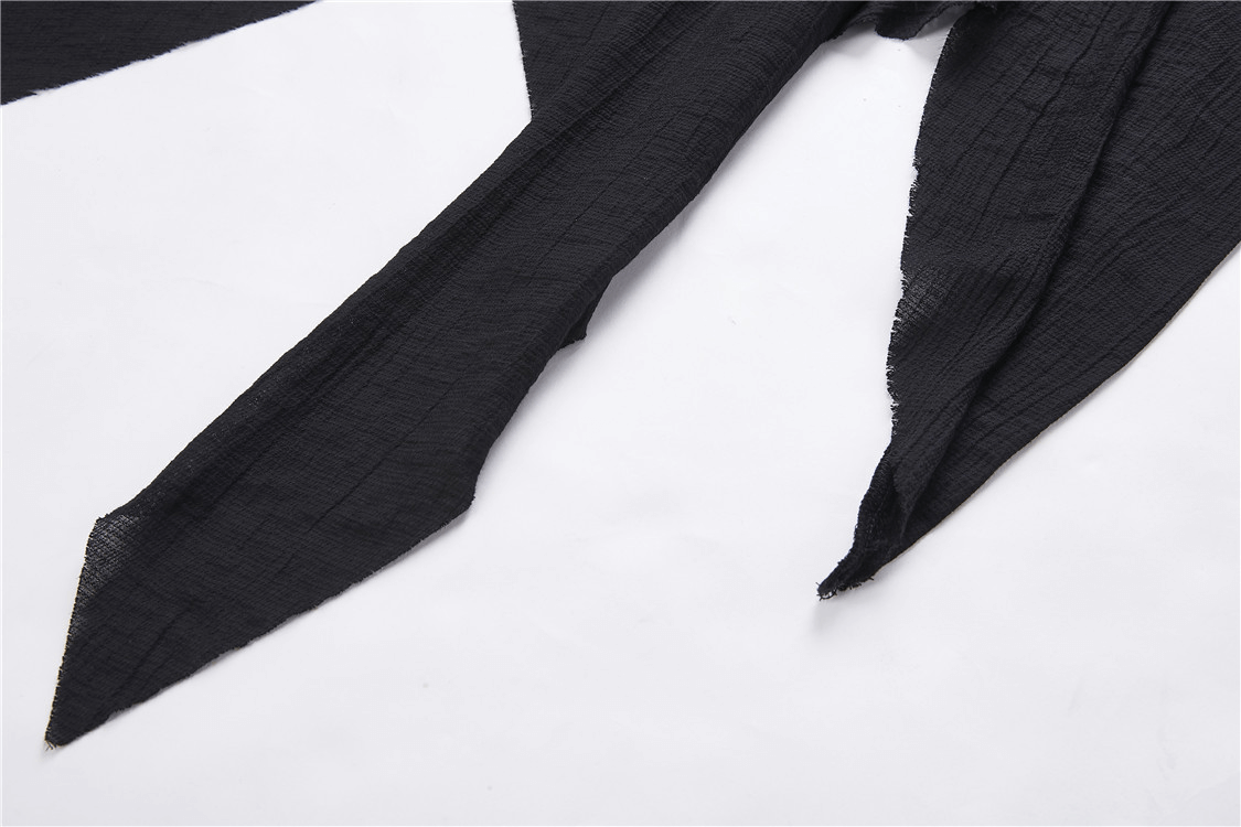 Close-up of black shredded fabric details from the Gothic Punk Hoodie Trench Coat, highlighting its edgy texture.