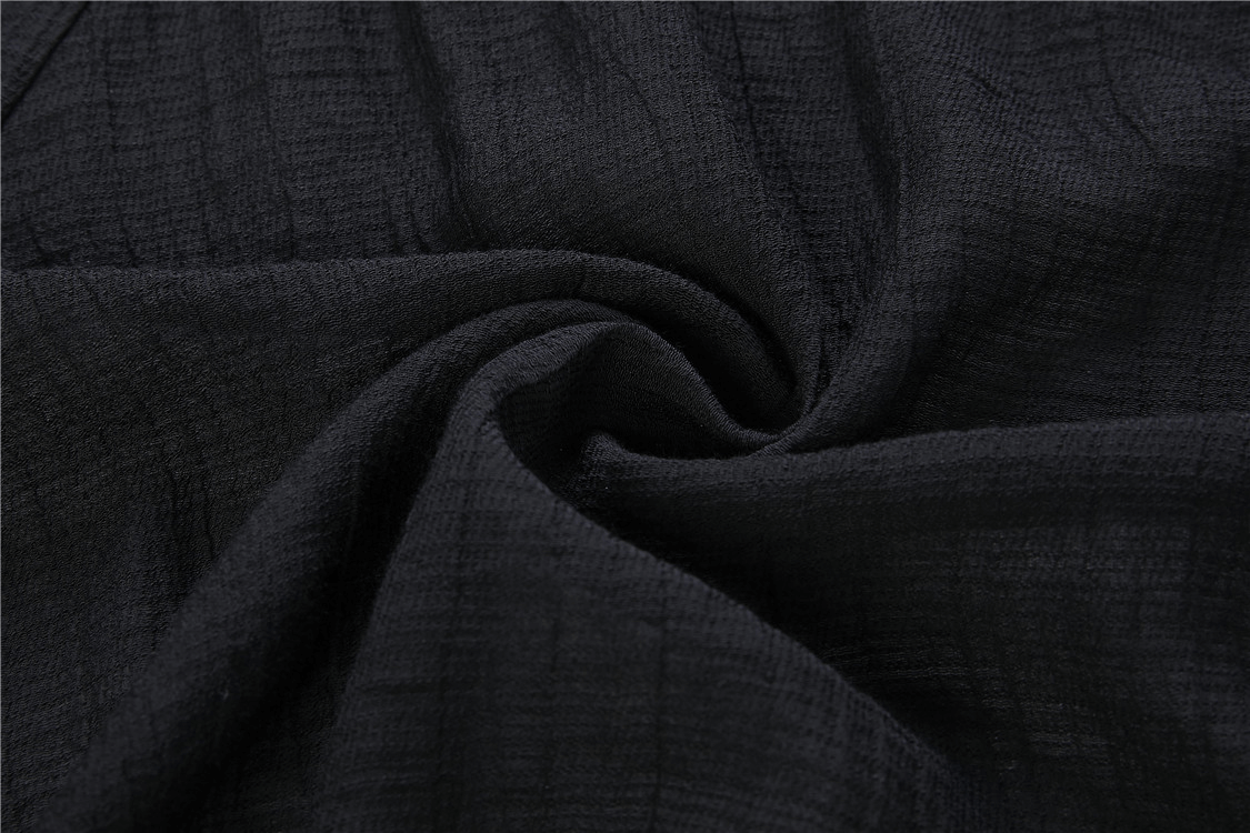Close-up of soft, black textured fabric perfect for gothic clothing.