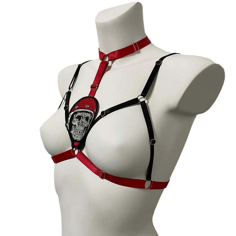 Cupless elastic body harness for women with skull detail, combining gothic and erotic fashion elements.