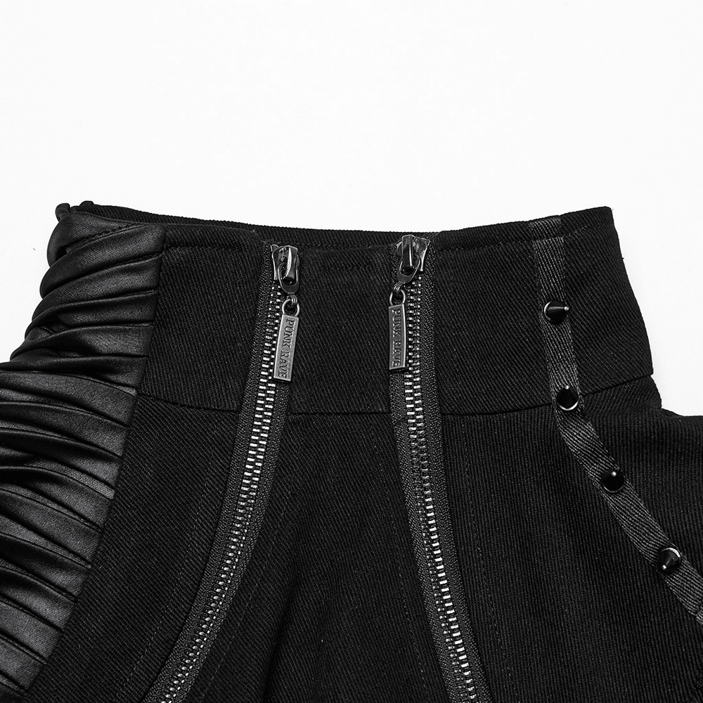 Close-up of a cyberpunk black cropped jacket featuring zippers and mesh detailing for a trendy look.