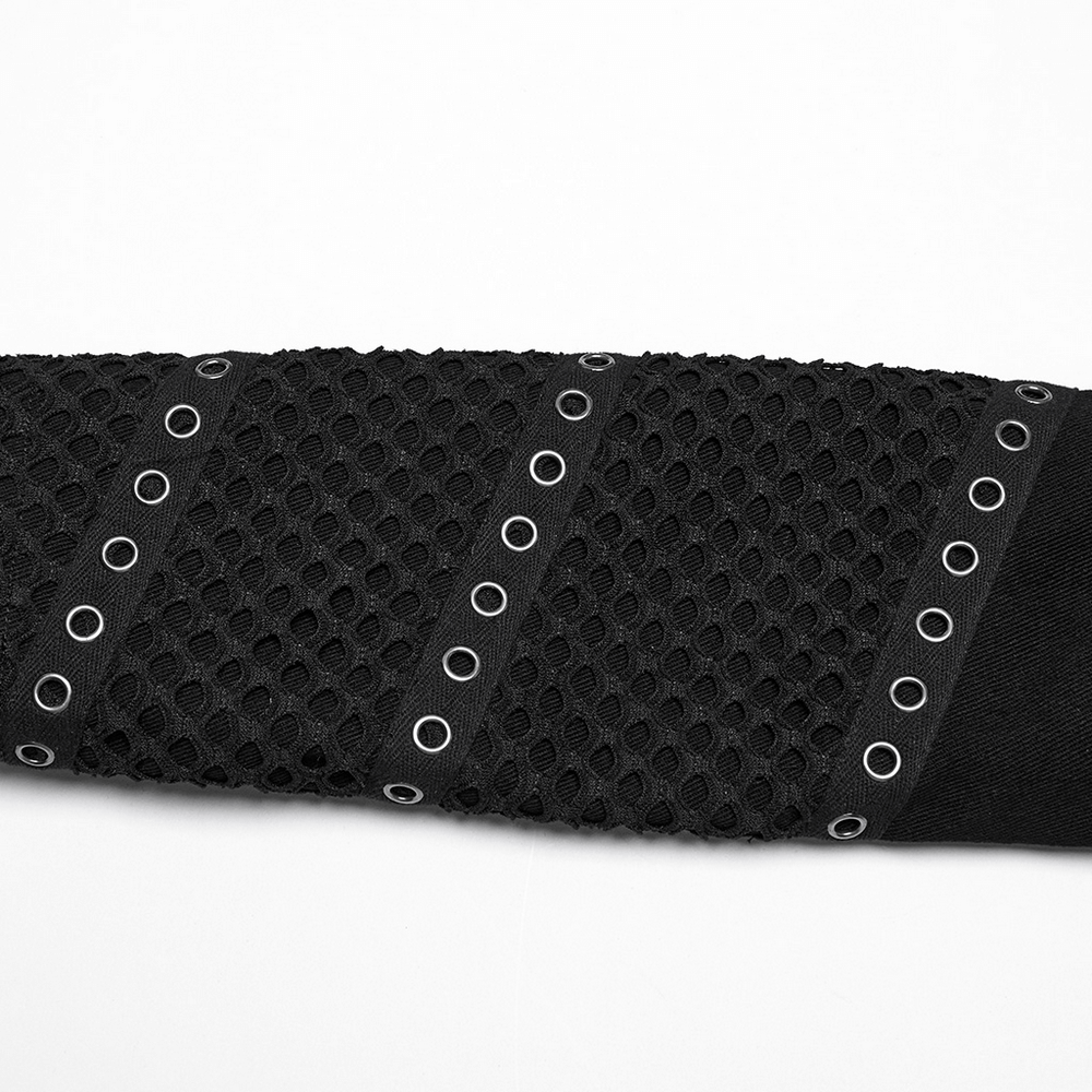 Close-up of the mesh detailing and zippers on a cyberpunk black cropped jacket.