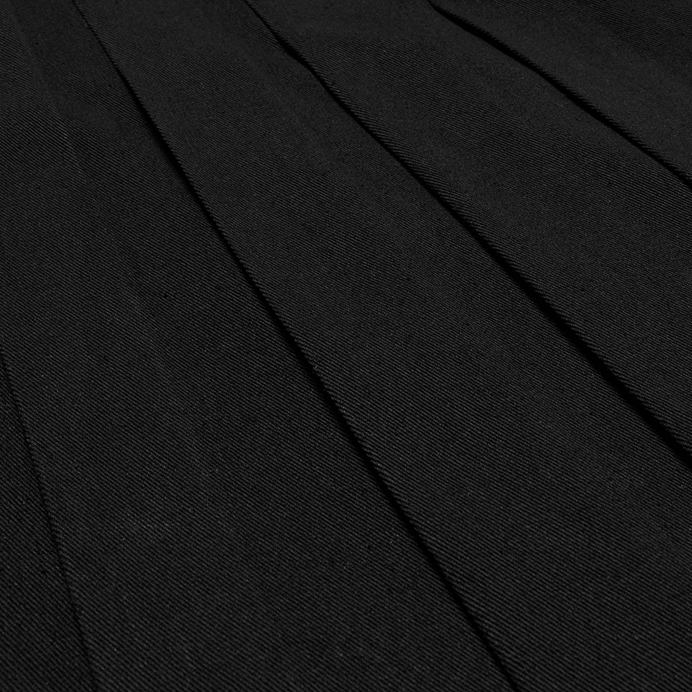 Close-up of black pleated twill fabric showcasing structured design for men's punk half skirt.