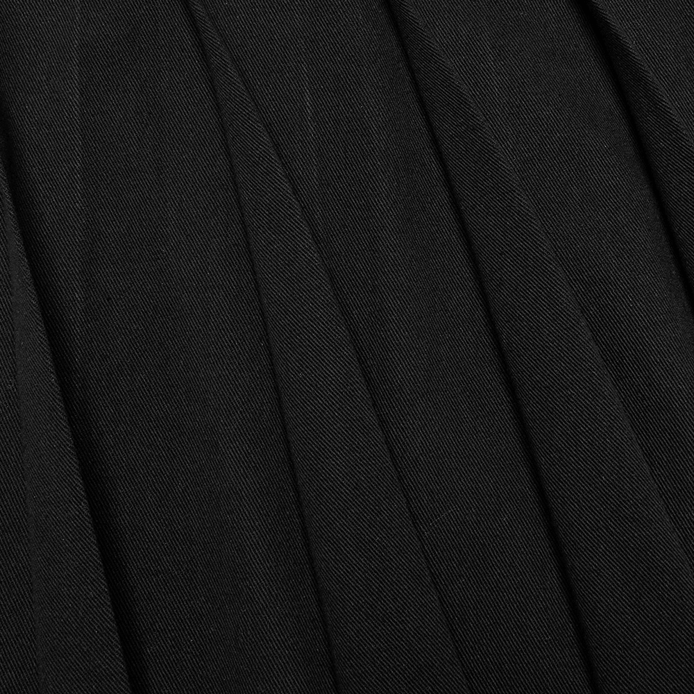 close-up of pleated black fabric showcasing textured details of a cyberpunk-inspired men's half skirt