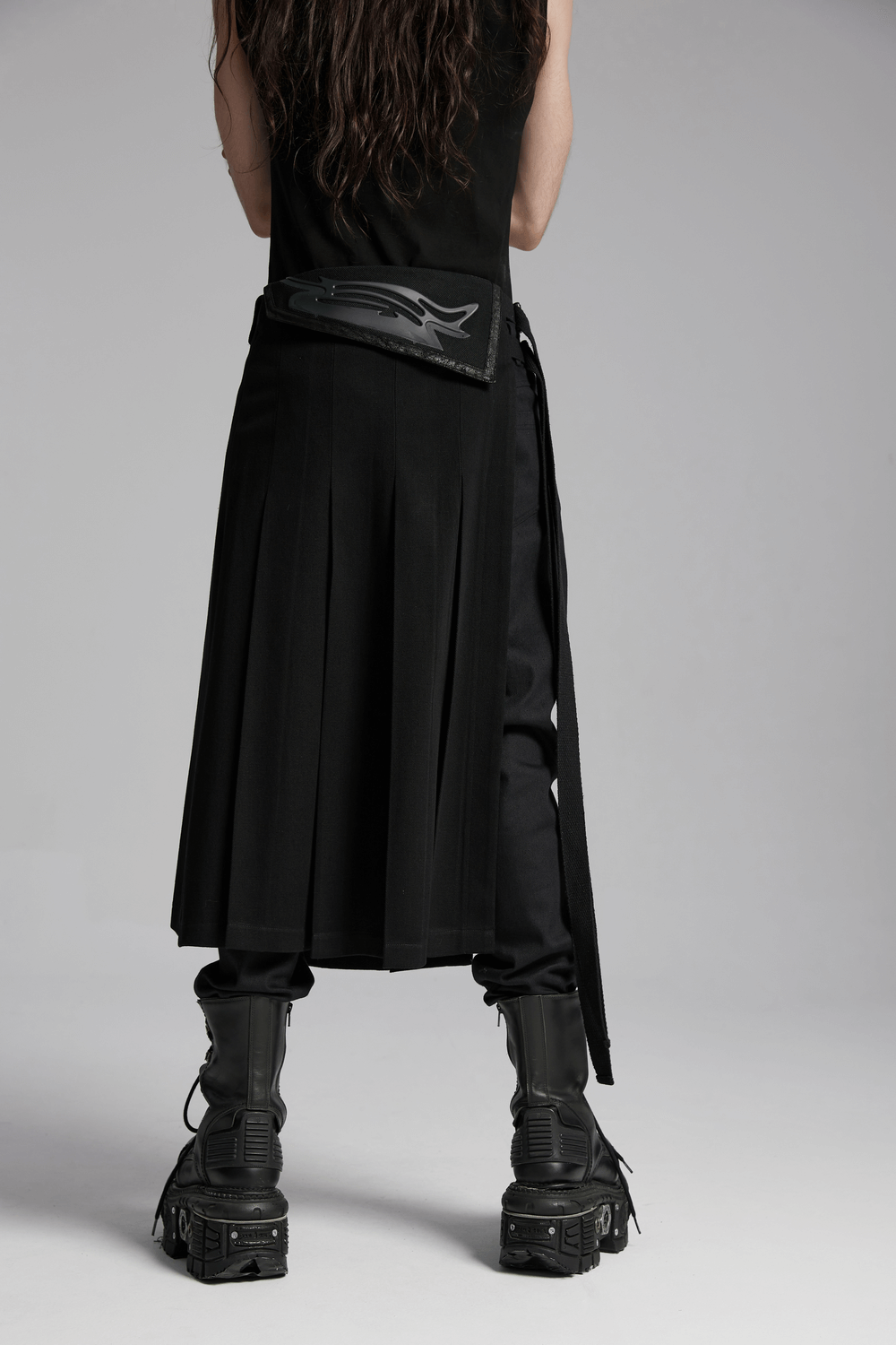 Black men's pleated half skirt with adjustable buckle, showcasing a bold cyber design and stylish streetwear vibe.