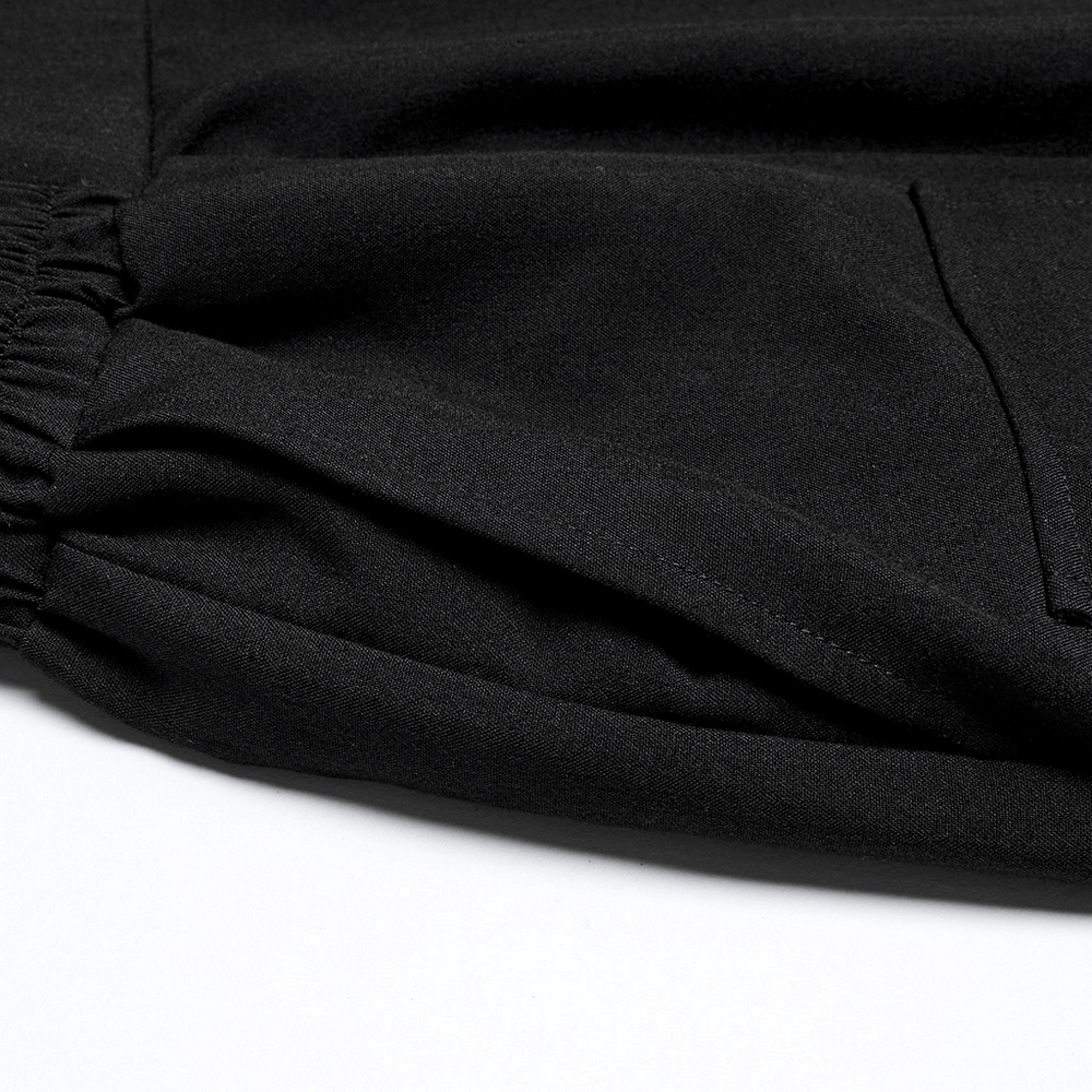 Close-up of the elastic waistband and fabric detail of cyberpunk black wide-leg cropped pants.