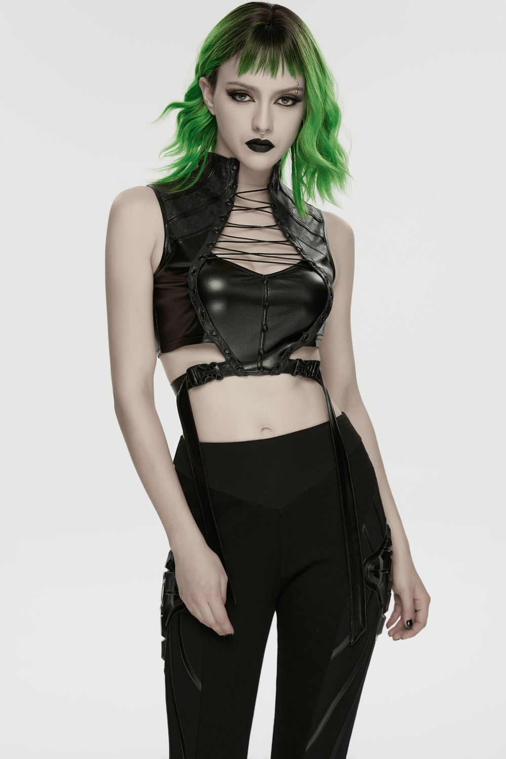 Alt Tag: Cyberpunk Faux Leather Lace Up Harness Crop Top on model, black buckle waist cutout gothic top with lace-up front and straps
