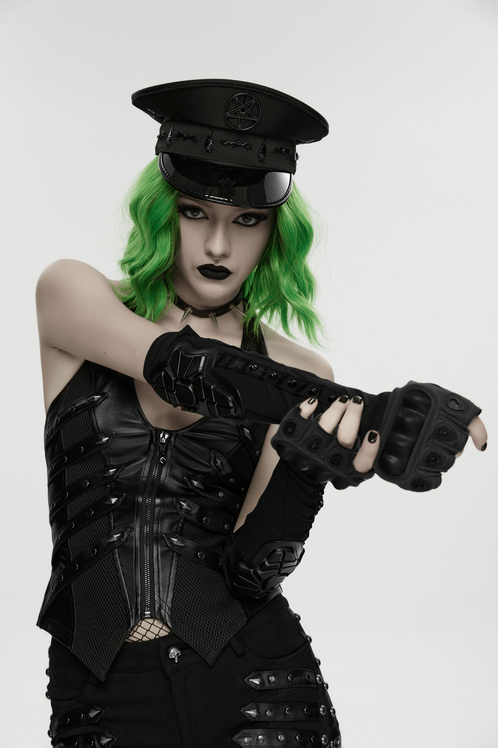 Cyberpunk Fingerless Gloves with Shock-Absorbing Armor worn by model with green hair and edgy outfit.