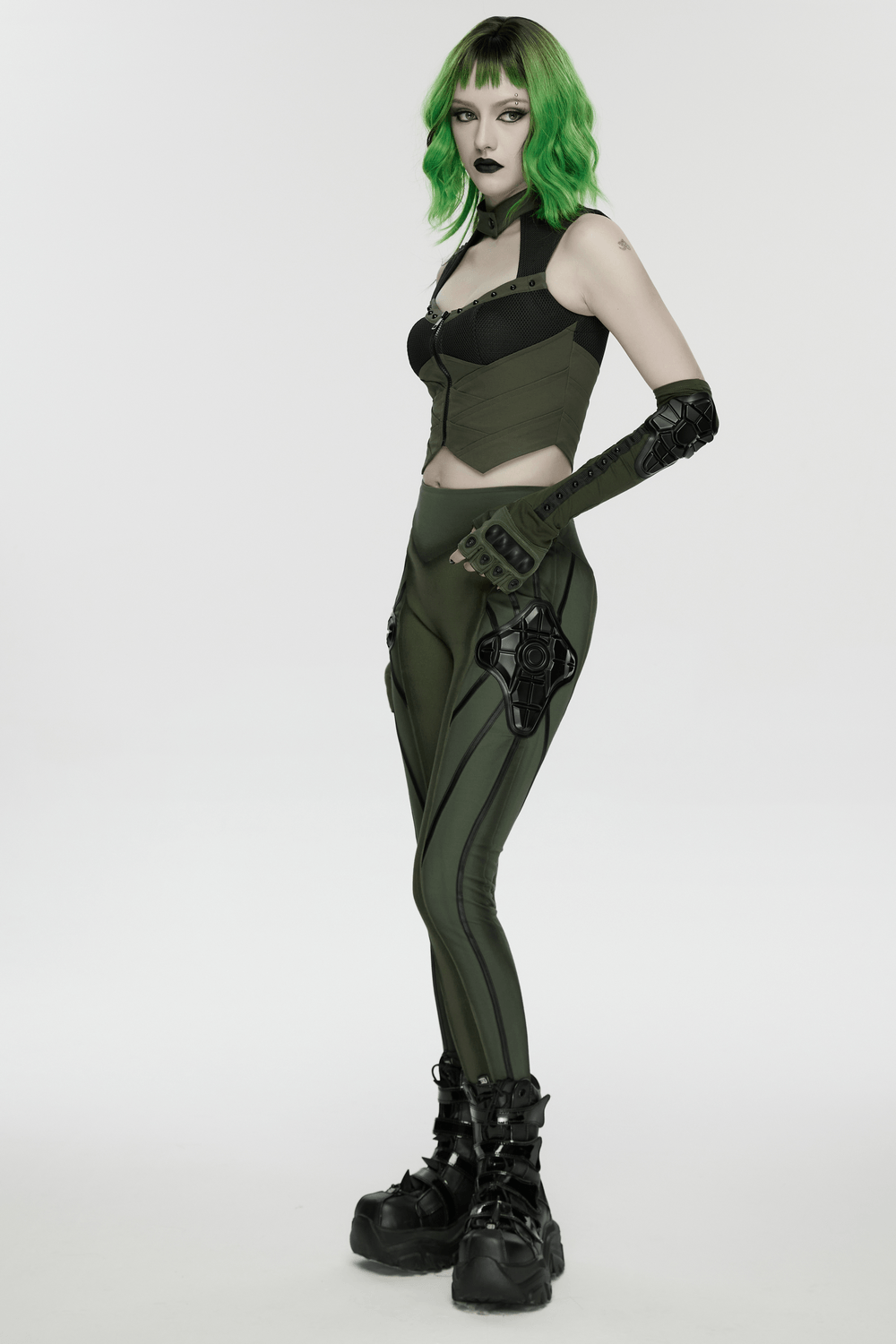 Cyberpunk Leggings with Futuristic Panel Design showcased on model with green hair, highlighting bold armor accents.