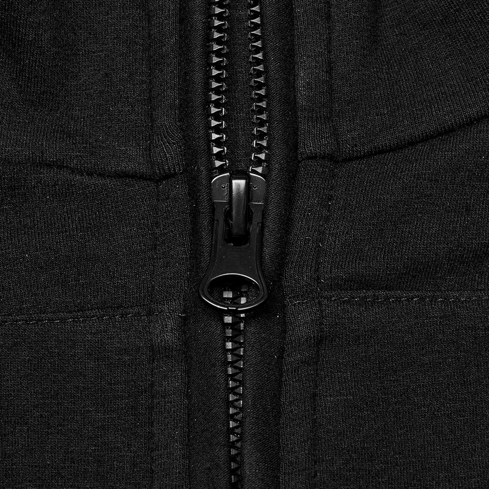 Close-up of a black zipper on a sleek tactical top, showcasing durable design and functionality for outdoor adventures.