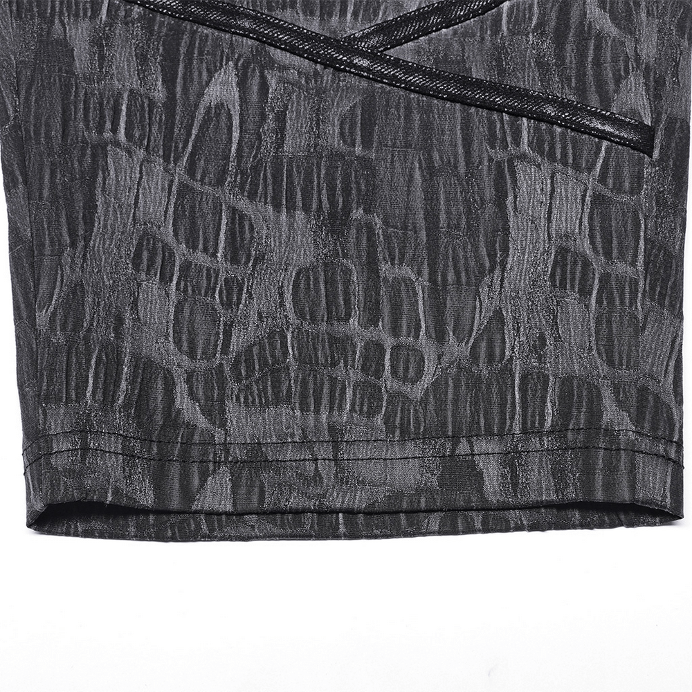 Close-up of Cyberpunk men's snake texture cropped trousers featuring contrasting ribbon layers.