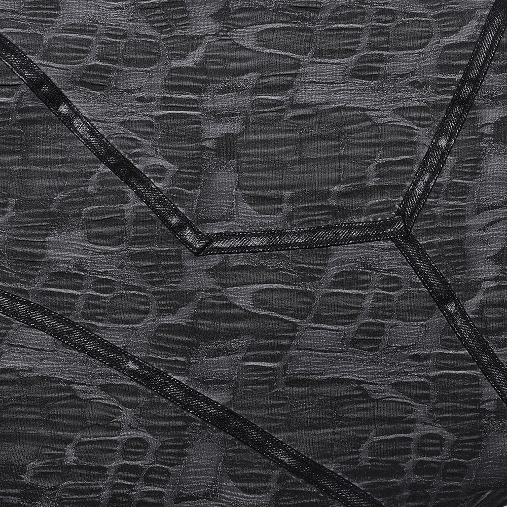 Close-up of stylish snake texture fabric in black with contrasting color ribbon layers for men's cropped trousers.