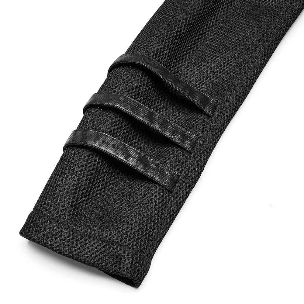 Close-up of decorative straps on a sleek black mesh coat, highlighting cyberpunk style and design.