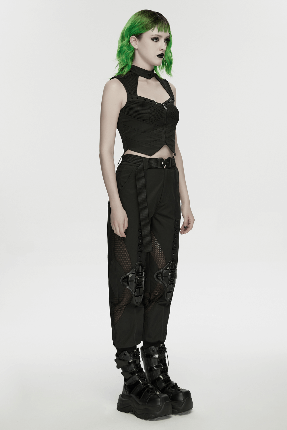 Cyberpunk Mesh Cargo Jogger Pants with Rubber Knees worn by a model with green hair and stylish accessories.