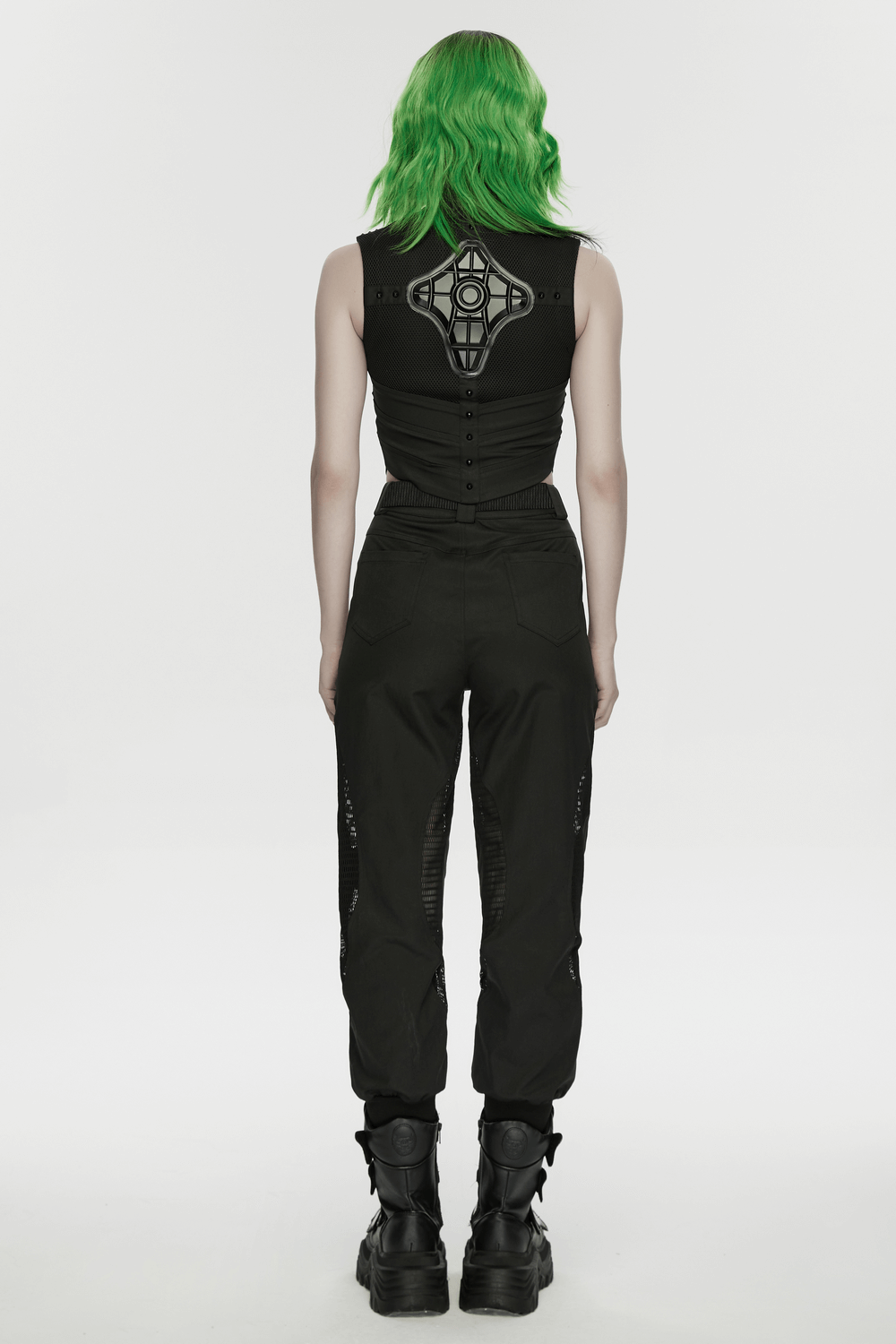 Cyberpunk Mesh Cargo Jogger Pants with Rubber Knees worn from the back, showcasing green hair and stylish ankle boots.
