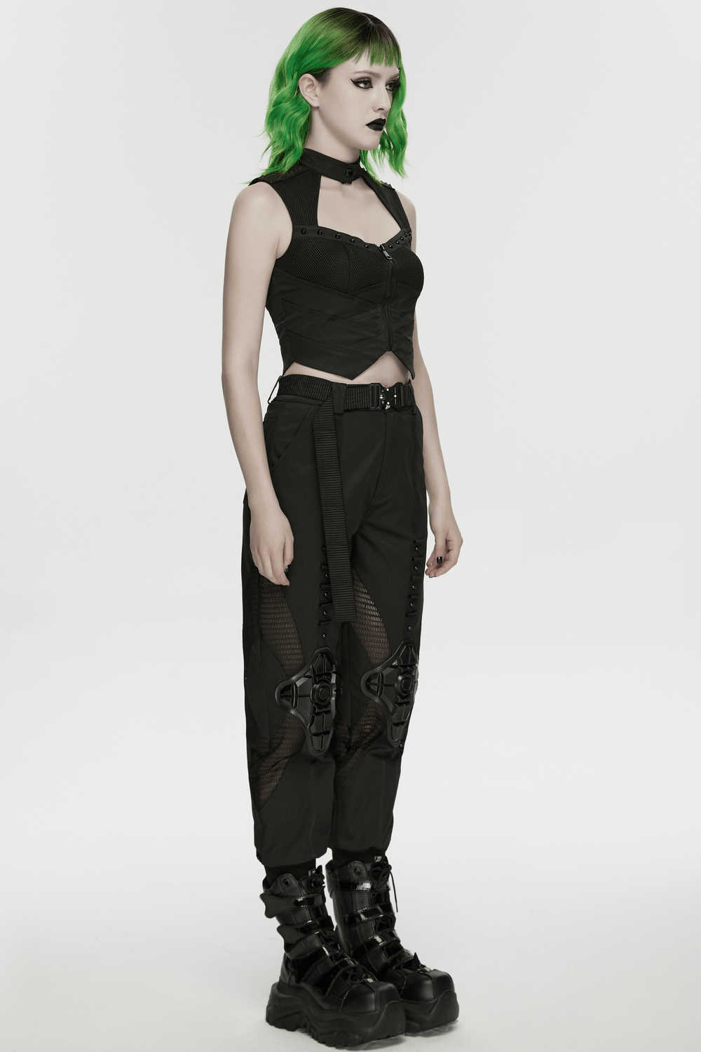 Cyberpunk Mesh Halter Top with Studs and Zipper worn by model with green hair and black pants.