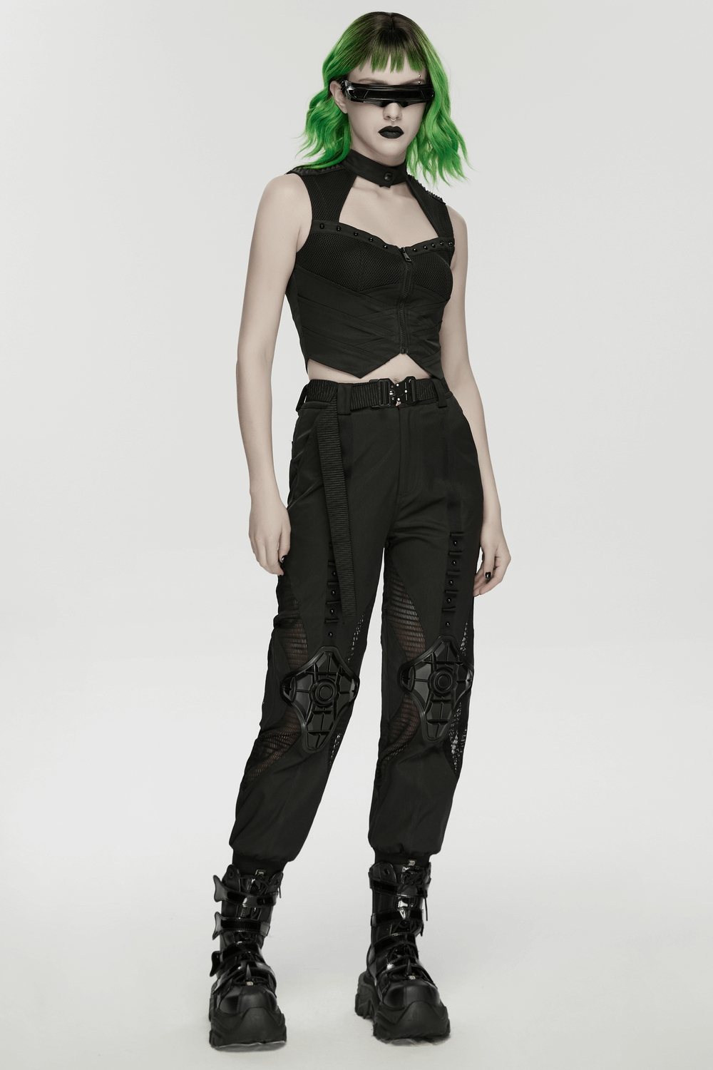 Cyberpunk Mesh Halter Top with Studs and Zipper model wearing sleek black techwear outfit with green hair and futuristic accessories.