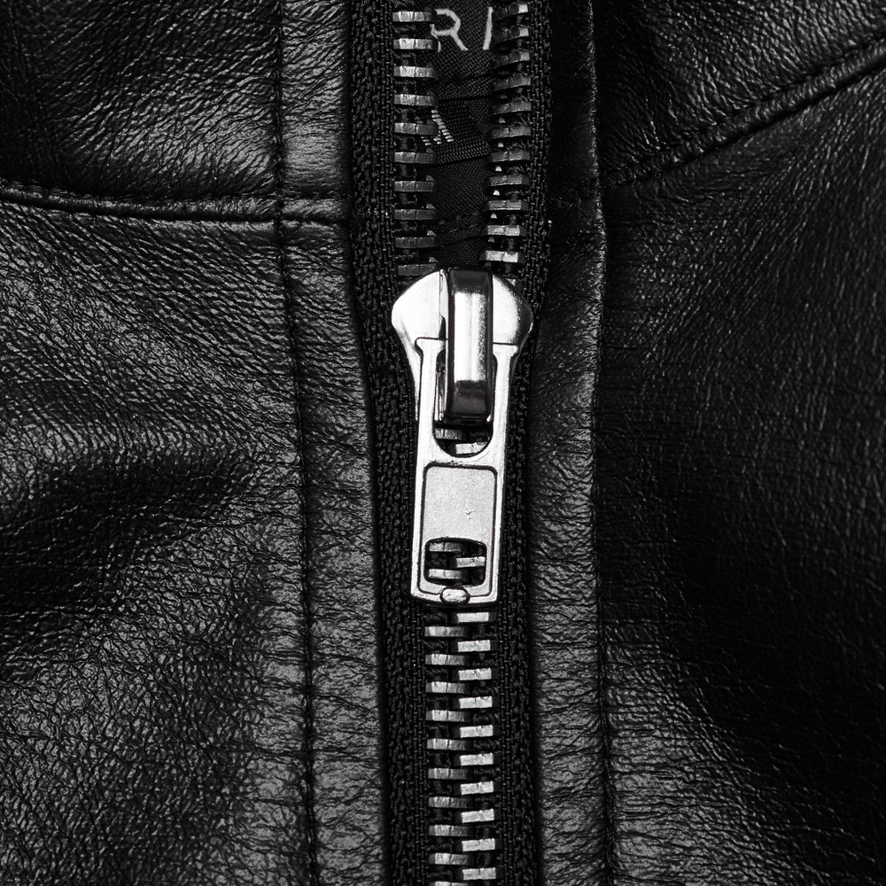 Close-up of a sleek black leather jacket zipper showcasing shiny metal teeth and high-quality craftsmanship.