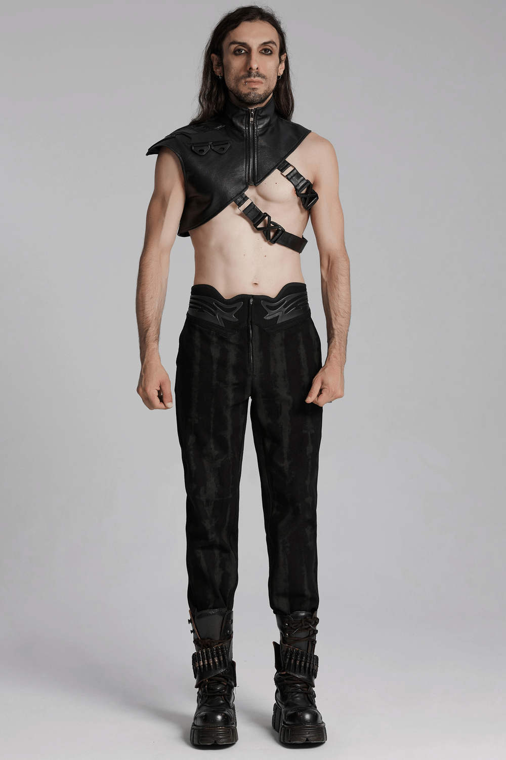 Cyberpunk shoulder armor with adjustable buckles, model wearing sleek black pants and stylish boots for a bold look.